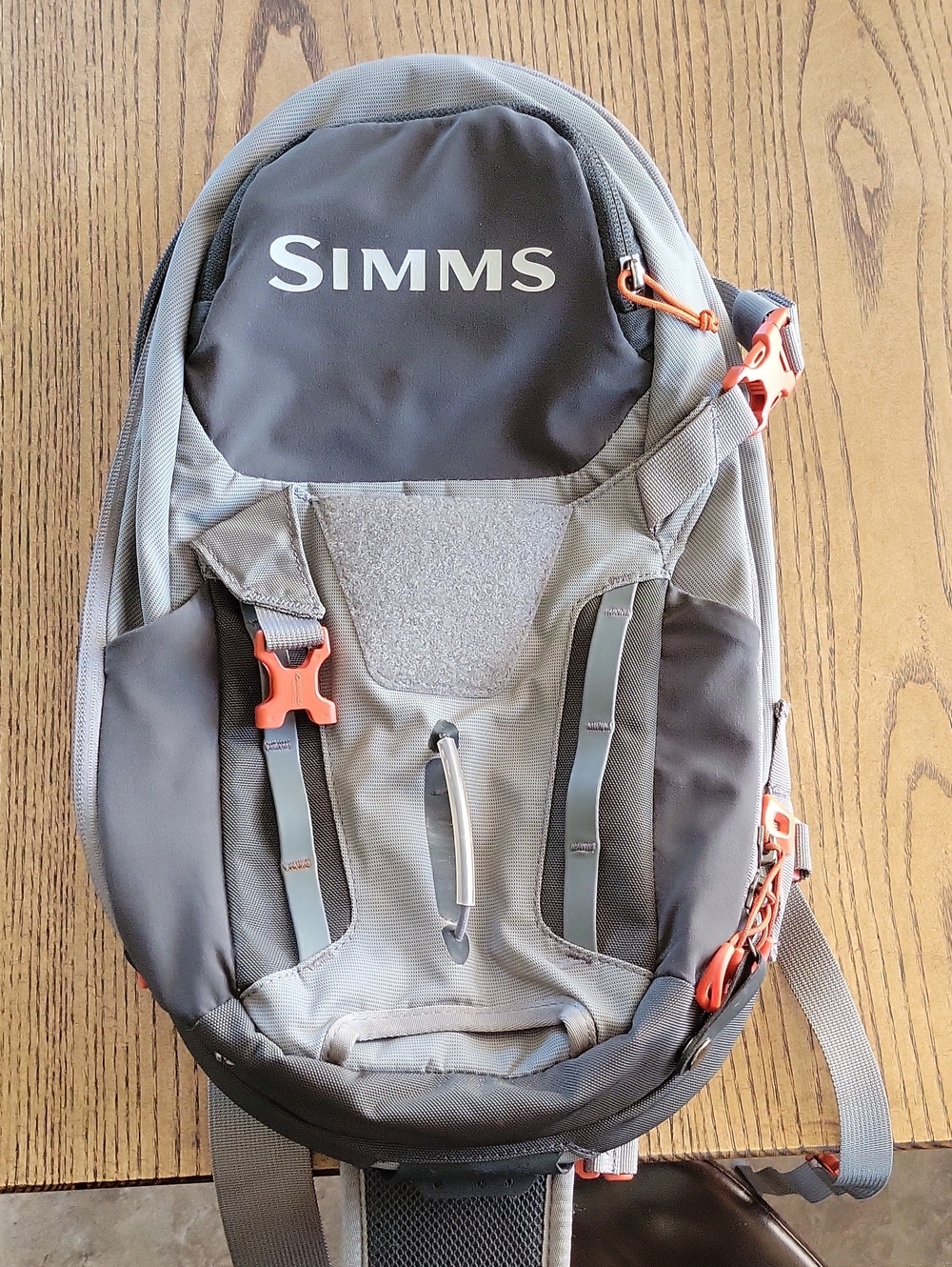 Simms Freestone Ambidextrous Gray Sling Pack with Orange Accents